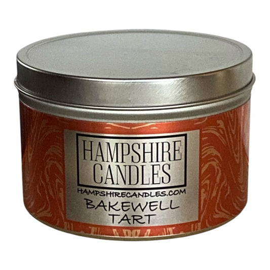 Bakewell Tart scented candle tin with eco-friendly soy wax, hand-poured for long-lasting fragrance.
