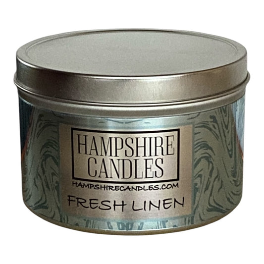 Fresh Linen scented candle tin with sleek design, hand-poured soy wax for a clean burn.