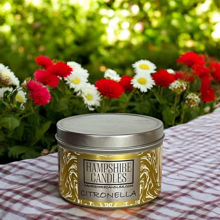 "Eco-friendly citronella candle in a tin, perfect for outdoor summer evenings."