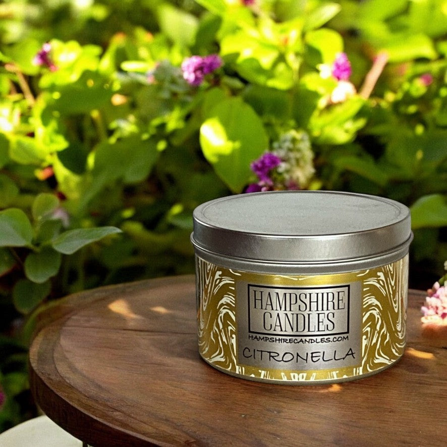 "Insect-repelling citronella soy wax candle tin with a fresh citrus aroma."