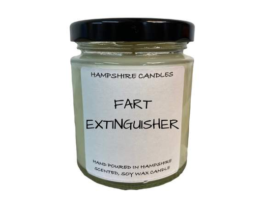 Glass jar candle with the funny quote "Fart Extinguisher" on the front, perfect for lighthearted gifting.